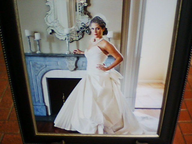 picture of bride leaning on fireplace
