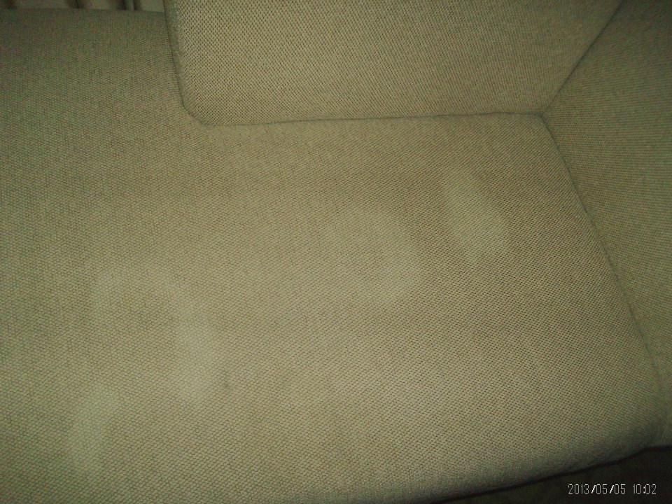 Three large and white stains on a sofa/seat next to the sliding balcony door. Hyatt Grand Cypress